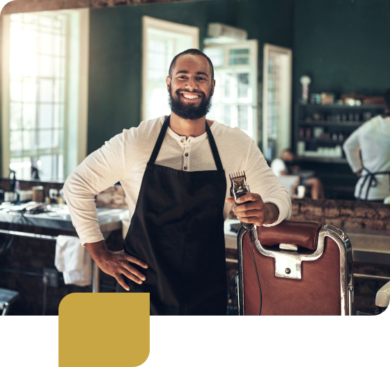 Business owner standing in front of mirror