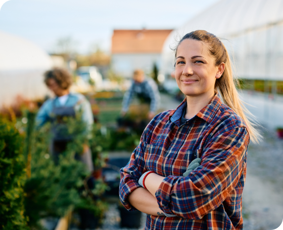 Business owner outside of greenhouse