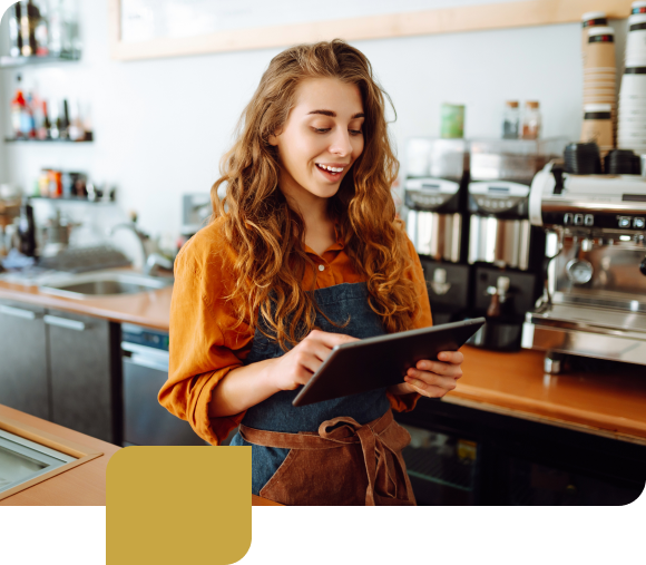 Business owner on tablet computer smiling