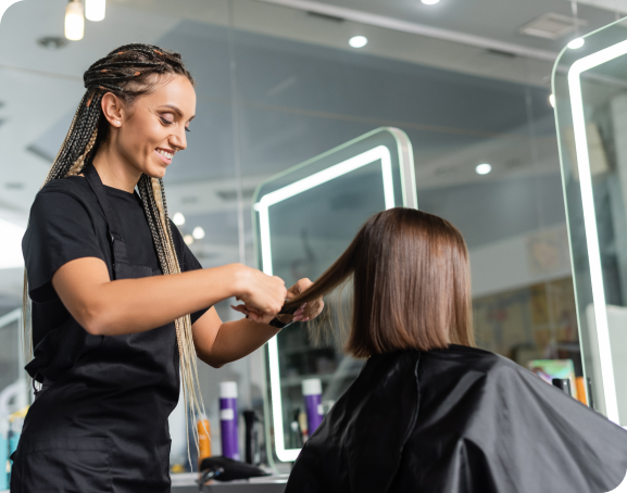 Stylist cutting someone's hair